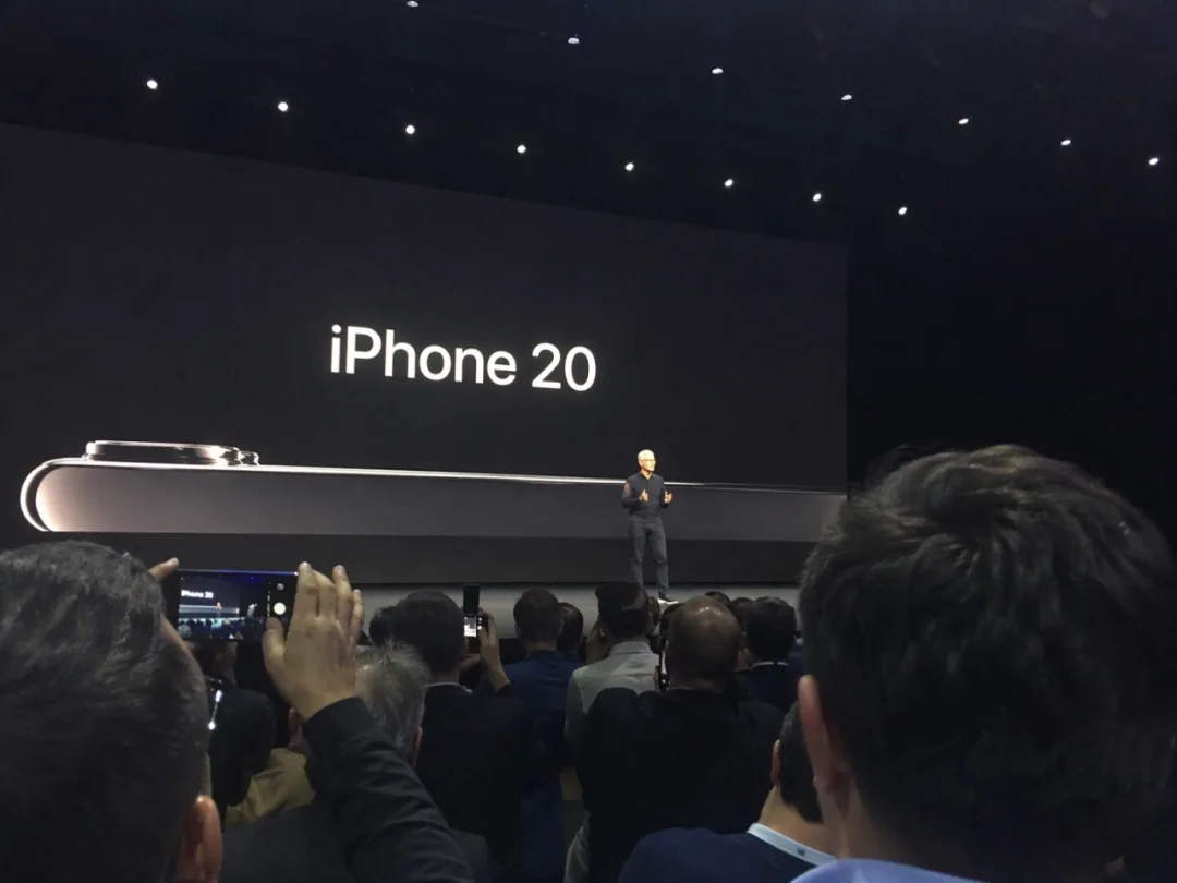 Amateur photo of Tim Cook speaking at iPhone 20 launch event at Apple Park