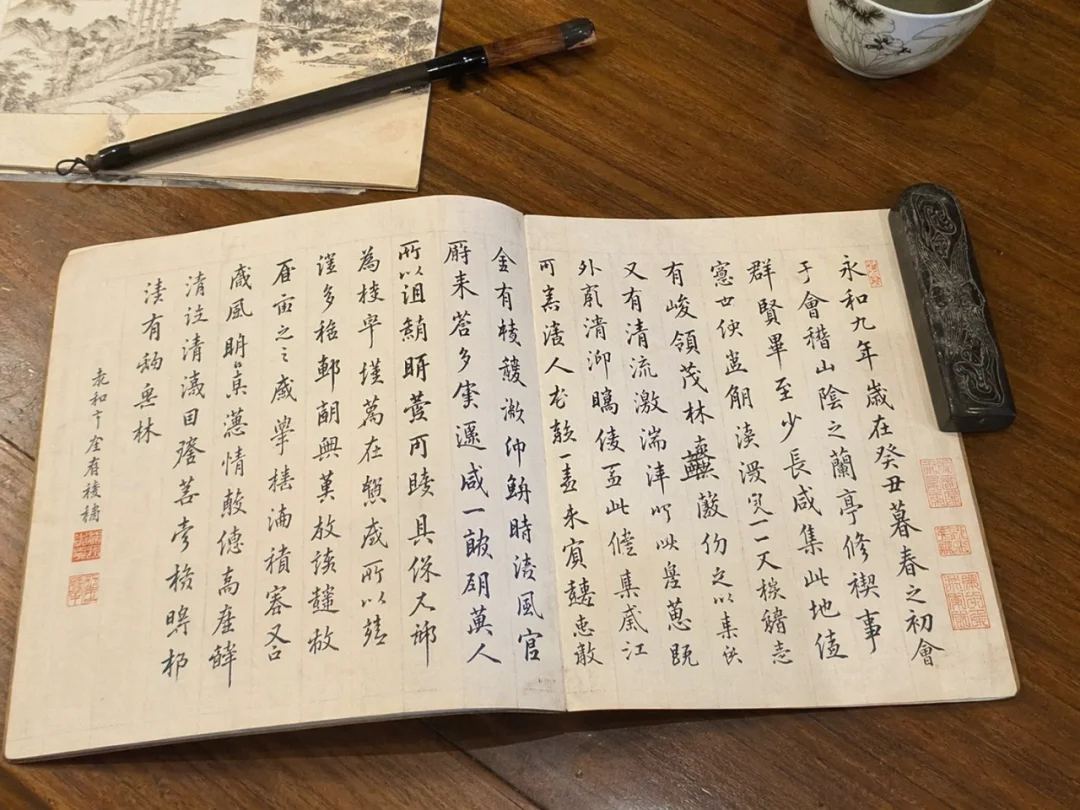 Phone photo of the Orchid Pavilion Preface calligraphy laid on a desk